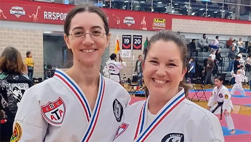 Two students with their tournament medals